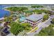 Stunning aerial view of a luxurious pool area, elegant buildings, and lush landscaping, perfect for relaxation at 5702 Tides Pl, Apollo Beach, FL 33572