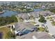 Aerial view of waterfront homes featuring lush landscaping and mature trees at 5702 Tides Pl, Apollo Beach, FL 33572
