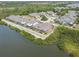 Community aerial showcasing waterfront homes, manicured lawns, and a tranquil lake setting at 5702 Tides Pl, Apollo Beach, FL 33572