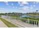 Scenic backyard view overlooking a tranquil canal with lush landscaping and waterfront homes at 5702 Tides Pl, Apollo Beach, FL 33572