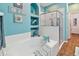 Bright bathroom with tub, shower, and decorative shelving at 5702 Tides Pl, Apollo Beach, FL 33572