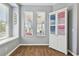 Sunlit breakfast nook with a decorative armoire and large windows overlooking the porch at 5702 Tides Pl, Apollo Beach, FL 33572