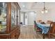 Bright dining area with wood floors with hutch and natural light at 5702 Tides Pl, Apollo Beach, FL 33572