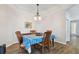 Charming dining room featuring wood floors and a decorative chandelier at 5702 Tides Pl, Apollo Beach, FL 33572