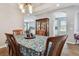 Lovely dining area with wood floors, archway, and decorative hutch at 5702 Tides Pl, Apollo Beach, FL 33572