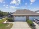 Well-maintained home with a two-car garage, screened lanai, and nicely landscaped front yard at 5702 Tides Pl, Apollo Beach, FL 33572