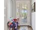 Welcoming foyer with a view through french doors to the outdoor screened in patio at 5702 Tides Pl, Apollo Beach, FL 33572