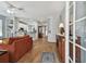 Open-concept living room with wood floors, a ceiling fan, and easy access to the kitchen at 5702 Tides Pl, Apollo Beach, FL 33572