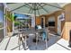 Relax on the covered patio with outdoor seating, perfect for enjoying the Florida sunshine and fresh air at 5702 Tides Pl, Apollo Beach, FL 33572