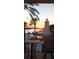 Balcony view of the community pool area with a slide and lighthouse under the sunset at 5702 Tides Pl, Apollo Beach, FL 33572