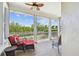 Inviting screened-in porch with comfortable seating and relaxing waterfront view at 5702 Tides Pl, Apollo Beach, FL 33572