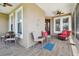 Inviting screened-in porch with ample seating, ceiling fan, and sliding screen door at 5702 Tides Pl, Apollo Beach, FL 33572