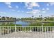 Serene water view featuring a wide canal lined with lush greenery and palm trees at 5702 Tides Pl, Apollo Beach, FL 33572