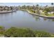 Expansive water view showcasing boats, waterfront homes, and lush green surroundings at 5702 Tides Pl, Apollo Beach, FL 33572
