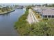 Picturesque waterfront homes with well-kept lawns and serene canal views, ideal for relaxing at 5702 Tides Pl, Apollo Beach, FL 33572
