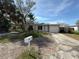 Charming single-story home with an attached garage, awaiting restoration at 6609 Sierra Ter, New Port Richey, FL 34652