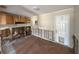 Kitchen area with wooden floors, and upper cabinets, needing renovation at 6609 Sierra Ter, New Port Richey, FL 34652