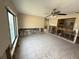 Bright living room featuring large windows, tiled floors, ready for renovation at 6609 Sierra Ter, New Port Richey, FL 34652