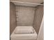 Bathroom with shower and neutral-toned tile, built-in shelving, and updated fixtures at 605 Brandy Wine Dr # 605, Largo, FL 33771