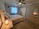 Comfortable bedroom featuring neutral tones, soft lighting, and tile floors at 605 Brandy Wine Dr # 605, Largo, FL 33771
