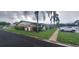 A side view of well-kept condo exteriors, showcasing landscaping and parking at 605 Brandy Wine Dr # 605, Largo, FL 33771