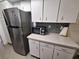 Bright kitchen area features stainless steel appliances and white cabinets at 605 Brandy Wine Dr # 605, Largo, FL 33771