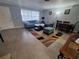 Comfortable living room with tile flooring, bright light and comfortable furniture at 605 Brandy Wine Dr # 605, Largo, FL 33771