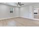 This bedroom features hardwood floors and a door leading to the rest of the house at 623 15Th Nw Ave, Largo, FL 33770