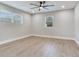 This bedroom features hardwood floors, a ceiling fan, and windows to let in plenty of light at 623 15Th Nw Ave, Largo, FL 33770