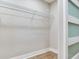 A bright walk-in closet features a wire shelving unit, wood floor, and a white trim finish at 623 15Th Nw Ave, Largo, FL 33770