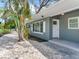 Charming home exterior featuring well-maintained landscaping, a modern paint scheme, and an inviting entrance at 623 15Th Nw Ave, Largo, FL 33770