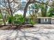 Charming single-story home with mature trees and lush landscaping, offering a serene and inviting curb appeal at 623 15Th Nw Ave, Largo, FL 33770