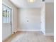 Well-lit laundry room featuring tile flooring, utility connections, and an exterior access door at 623 15Th Nw Ave, Largo, FL 33770