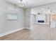 Spacious living room with hardwood floors and a modern electric fireplace feature at 623 15Th Nw Ave, Largo, FL 33770