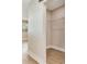 A simple walk-in closet featuring basic wire shelving with hardwood floors at 623 15Th Nw Ave, Largo, FL 33770