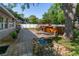 Spacious backyard featuring patio, pond, hot tub, and landscaped areas at 6801 5Th N St, St Petersburg, FL 33702