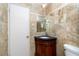 Tastefully designed bathroom featuring a dark vanity, with a mirror at 6801 5Th N St, St Petersburg, FL 33702
