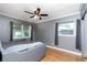 Bedroom with tile flooring, neutral color walls, dual windows, and ample space for personalized decor at 6801 5Th N St, St Petersburg, FL 33702