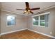 Well-lit bedroom featuring tile floors, two large windows and decorative crown molding at 6801 5Th N St, St Petersburg, FL 33702