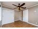 Bright bedroom with tile flooring, large closet, crown molding and multiple windows for ample natural light at 6801 5Th N St, St Petersburg, FL 33702