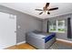 Cozy bedroom with a bed and a window, styled with a ceiling fan at 6801 5Th N St, St Petersburg, FL 33702