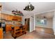Well-equipped kitchen with wood cabinets, tile backsplash, stainless steel appliances, and central island at 6801 5Th N St, St Petersburg, FL 33702