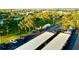 A landscaped aerial view of the property, highlighting the mature trees and nearby parking at 690 Island Way # 707, Clearwater Beach, FL 33767