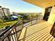 View from balcony showing landscaping, parking and city buildings in the distance at 690 Island Way # 707, Clearwater Beach, FL 33767