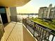 Relax on the balcony with stunning views of the waterfront and the adjacent building at 690 Island Way # 707, Clearwater Beach, FL 33767