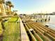 Boat dock renovation with new lumber with water access and grassy area in the back at 690 Island Way # 707, Clearwater Beach, FL 33767