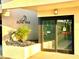 Inviting entrance to Island Walk, accented by lush landscaping and a covered entryway at 690 Island Way # 707, Clearwater Beach, FL 33767