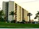 Exterior building shot showcasing the community and nearby parking at 690 Island Way # 707, Clearwater Beach, FL 33767