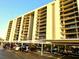 Exterior view of the building and covered parking available to residents and visitors at 690 Island Way # 707, Clearwater Beach, FL 33767