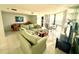 Comfortable living room with a large sectional sofa, a balcony view, and an open layout at 690 Island Way # 707, Clearwater Beach, FL 33767